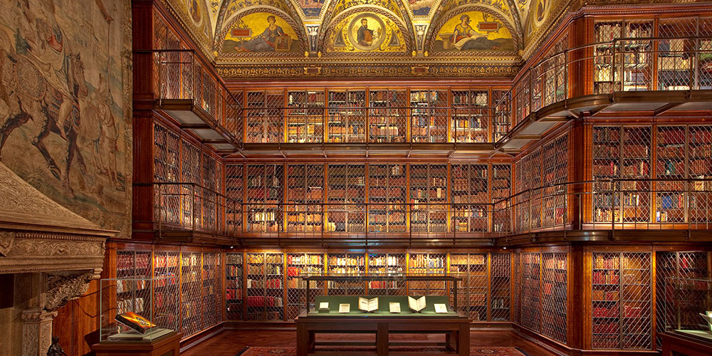 Photograph of East Room showing ornate ceiling and floor to ceiling bookshelves.
